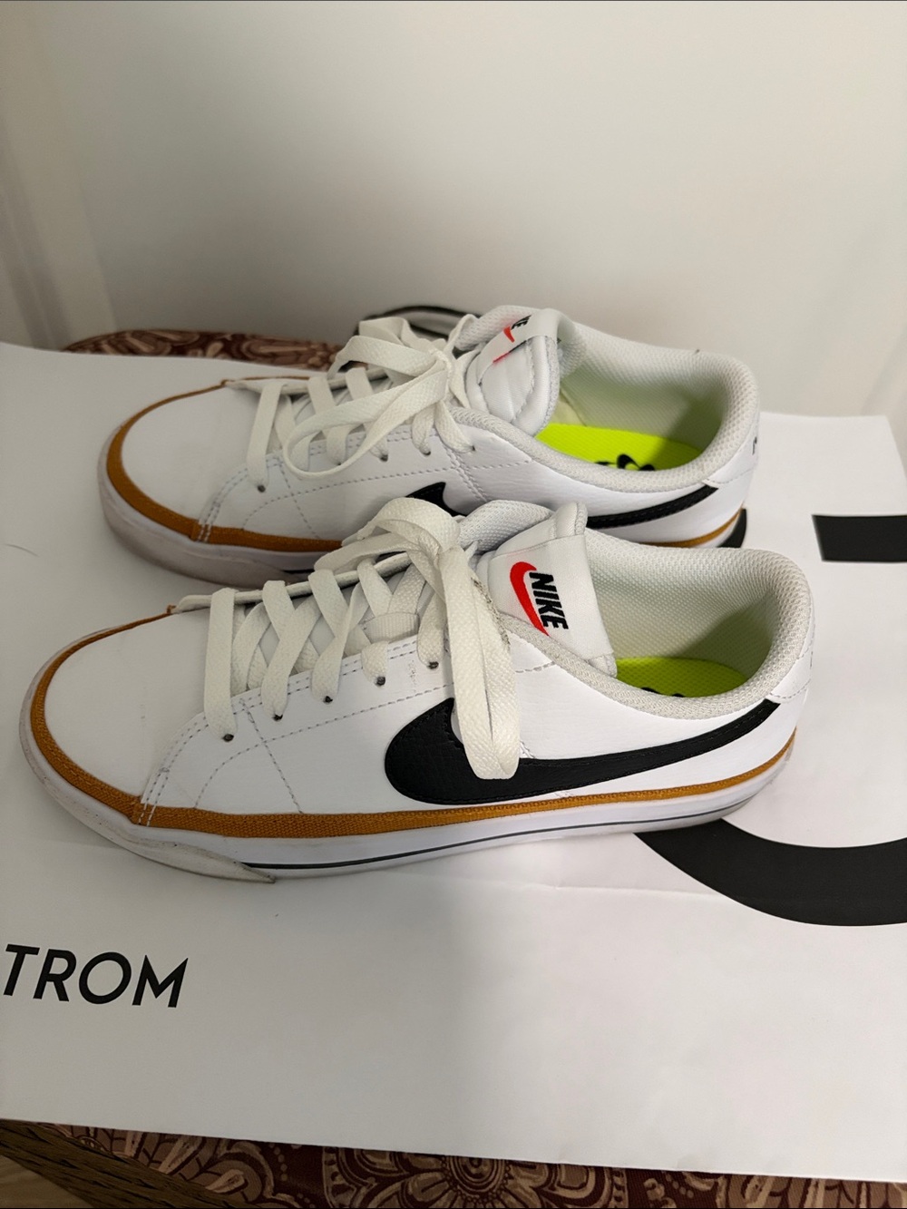 Nike Kids White Sneakers with Black Swoosh and Tan Trim